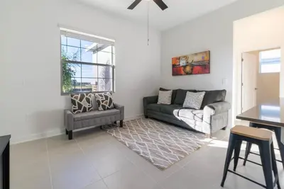 a living room with a couch and a table at Remote workers apartment or Long Stay Home