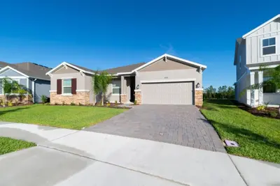 a house with a driveway and a garage at Remote workers apartment or Long Stay Home