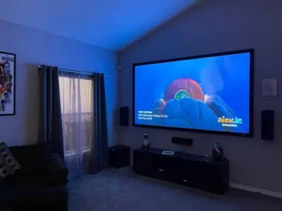 a living room with a large flat screen tv at Woodcrest Luxury by Paradise Resort Vacations in Orlando