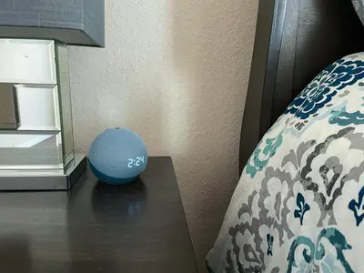 a blue ball sitting on a table next to a bed at Woodcrest Luxury by Paradise Resort Vacations in Orlando