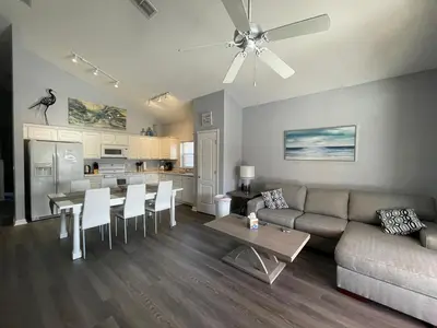 a living room with a couch and a table at Woodcrest Luxury by Paradise Resort Vacations in Orlando
