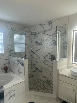 a bathroom with a shower and a tub and a sink at Ruby-rose Retreat in Kissimmee