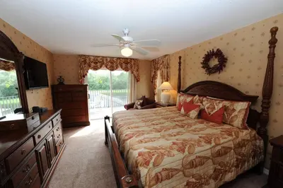 a bedroom with a bed and a ceiling fan at Tranquil Waters Haven in Kissimmee