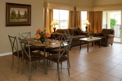 a living room with a table and a couch at Luxury 3-bed Condo Near Disney Worldquest Resort in Orlando