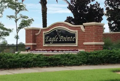 a sign for the entrance to a brick building at Near Disney Private Pool 4 Bedrooms in Kissimmee