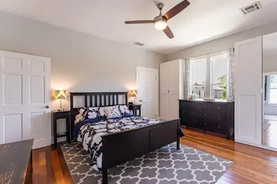 a bedroom with a bed and a ceiling fan at Cozy 3BR Retreat - Near Bars Zoo & Lake Trails in Sanford
