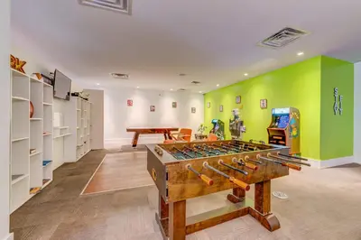 a room with a large table with guns in it at Surf and Sun Stitch Studio Kissimmee in Kissimmee