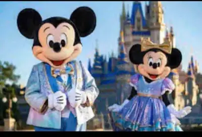 two mickeys dressed in costumes in front of walt disney world at Condo Disney Universal Epic Free Parking in Orlando