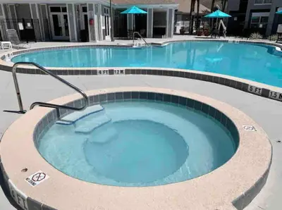 a large hot tub in a hotel swimming pool at Condo Disney Universal Epic Free Parking in Orlando