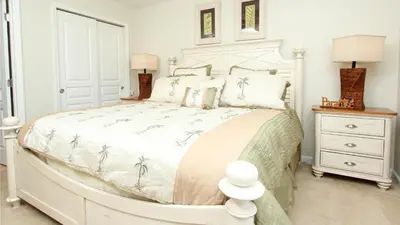 a white bedroom with a large white bed with pillows at Urban 6 Bed 4 Bath Villa- Perfect stay while exploring Orlando,Florida in Orlando