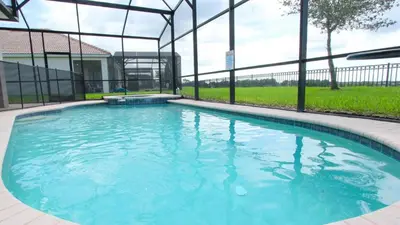 a swimming pool with blue water in a building at Urban 6 Bed 4 Bath Villa- Perfect stay while exploring Orlando,Florida in Orlando