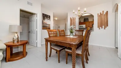 a dining room with a wooden table and chairs at Urban 3 Bed 2 Bath Condo- Perfect stay while exploring Orlando,Florida in Orlando