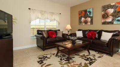 a living room with two couches and a coffee table at Contemporary 4 Bed 3 Bath Townhome - Near Walt Disney World W/ great amenities in Kissimmee