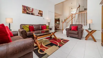 a living room with two couches and a table at Urban 5 Bed 5 Bath Villa - Perfect stay while exploring Orlando,Florida in Orlando