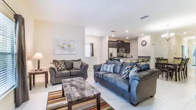a living room with two couches and a kitchen at GRH9244 - Storey Lake Resort - 5 Bed 4 Baths Townhome in Kissimmee