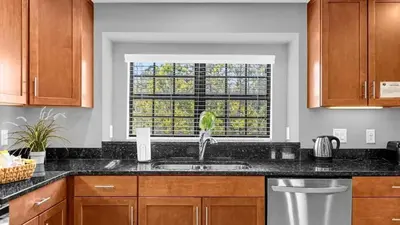 a kitchen with a sink and a window at Sunny Summer Deals - Renovated TownHome by Disney in Orlando