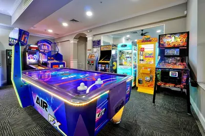 a room with a video game system and a game at Windsor Hills Resort - Water Park - Private Heated Plunge Pool - Near Disney in Orlando