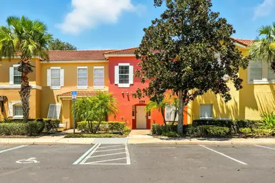 an empty parking lot in front of a building at Family Getaway Near Clubhouse and Community Pool 5 miles from Disney in Kissimmee