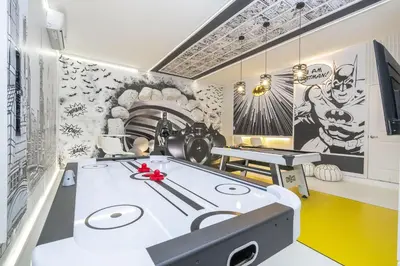 a room with a table and two ping pong tables at Disney Private Pool Game Room Themed Bedrooms. Book Now PG25 in Orlando