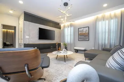 a living room with a couch and a tv at Disney Private Pool Game Room Themed Bedrooms. Book Now PG25 in Orlando