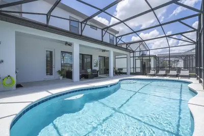 an indoor swimming pool with a glass ceiling at Disney Private Pool Game Room Themed Bedrooms. Book Now PG25 in Orlando