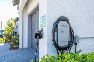 a pay phone is attached to a building at Disney Private Pool Game Room Themed Bedrooms. Book Now PG20 in Orlando