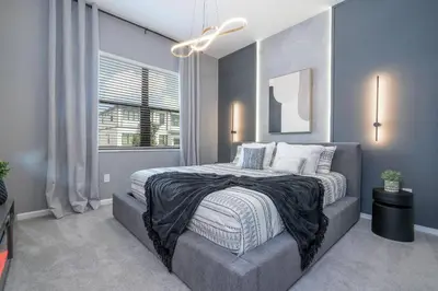 a bedroom with a large bed and a window at Disney Private Pool Game Room Themed Bedrooms. Book Now PG20 in Orlando