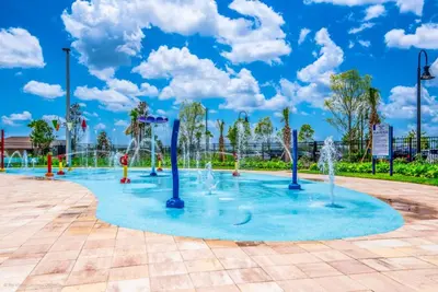 a playground with water fountains in a park at Disney Getaway Private Pool Themed Bedrooms. Book Now SLR1162 in Kissimmee