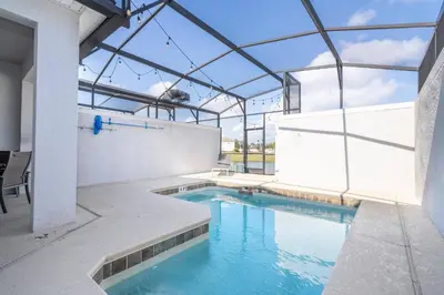 an indoor swimming pool with a glass ceiling at Disney Getaway Private Pool Themed Bedrooms. Book Now SLR410 in Kissimmee