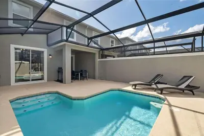 a swimming pool in a house with a glass ceiling at Disney Getaway Private Pool Themed Bedrooms. Book Now SLR411 in Kissimmee