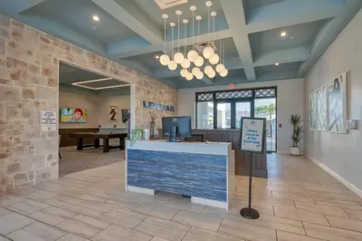 a lobby of a store with a counter and a table at Disney Getaway Private Pool Themed Bedrooms. Book Now SLR411 in Kissimmee