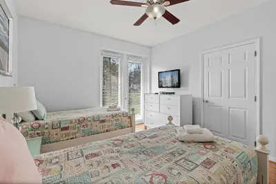 a bedroom with two beds and a ceiling fan at Disney Getaway Townhouse with Private Pool. Book Now VC304 in Orlando