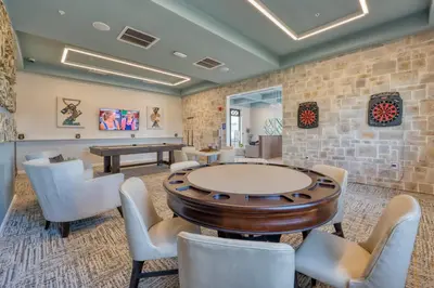 a room with a ping pong table and chairs at Disney Getaway Private Pool Themed Bedrooms. Book Now SLR481 in Kissimmee
