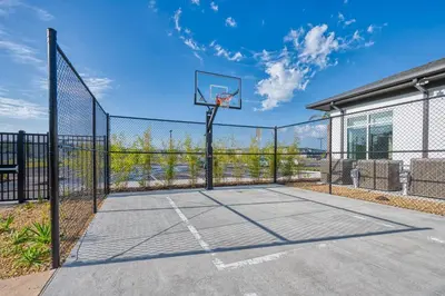 a basketball hoop on a tennis court at Disney Getaway Private Pool Themed Bedrooms. Book Now SLR481 in Kissimmee