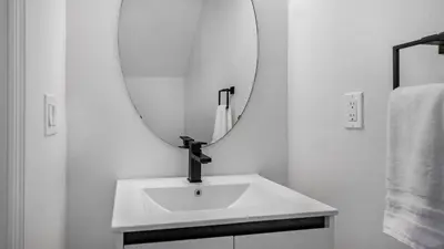 a bathroom with a sink and a mirror at Disney Private Pool Hot Tub Game Room Themed Bedrooms. Book Now EIR179 in Kissimmee