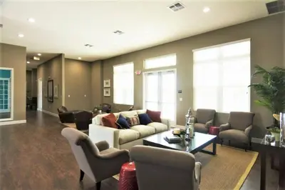 a living room with a couch and chairs and a table at Disney Getaway Townhouse with Private Pool. Book Now WLV82 in Kissimmee