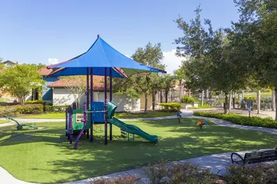 a playground with a slide in a park at Disney Getaway Private Pool Themed Bedrooms. Book Now BV241 in Kissimmee