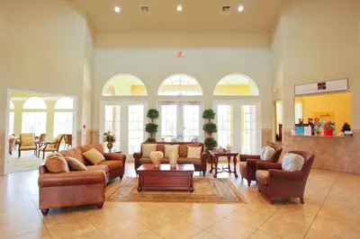 a large living room with couches and tables and windows at Disney Getaway Private Pool Game Room. Book Now BV77 in Kissimmee