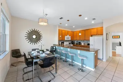 a kitchen and dining room with a table and chairs at Disney Private Pool Hot Tub Themed Bedrooms. Book Now BV76 in Kissimmee