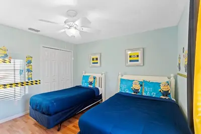 a bedroom with two beds and a ceiling fan at Disney Private Pool Hot Tub Themed Bedrooms. Book Now BV76 in Kissimmee