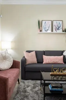 a living room with a couch and a table at Disney Getaway Private Pool Themed Bedrooms. Book Now LV8 in Kissimmee