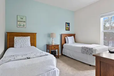 a bedroom with two beds and a window at Disney Getaway Private Pool Themed Bedrooms. Book Now LV7 in Kissimmee