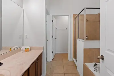 a bathroom with a sink and a shower and a mirror at Disney Getaway Luxury Villa with Private Pool Game Room. Book Now VP48 in Kissimmee