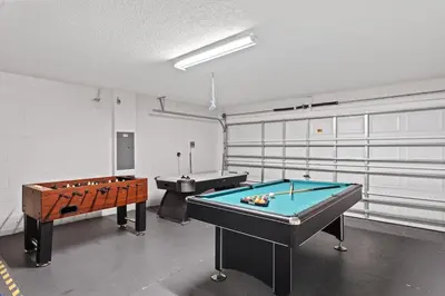 a room with two pool tables in it at Disney Getaway Luxury Villa with Private Pool Game Room. Book Now VP48 in Kissimmee
