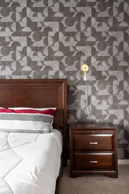 a bedroom with a bed with a nightstand and a wall at Disney Getaway Private Pool Themed Bedrooms. Book Now WLV83 in Kissimmee