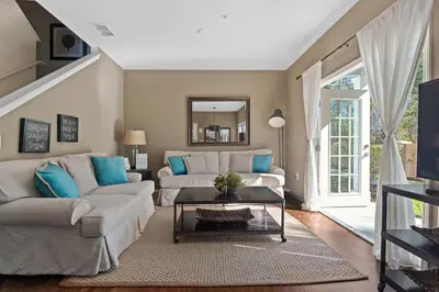 a living room with a couch and a table at Disney Getaway Private Pool Themed Bedrooms. Book Now WLV19 in Kissimmee