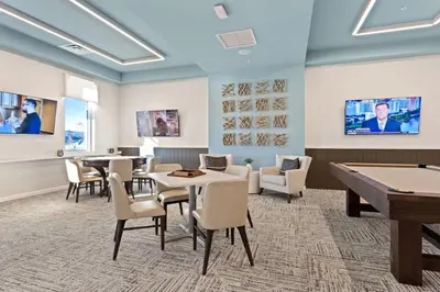 a room with tables and chairs and a pool table at Disney Getaway Private Pool Themed Bedrooms. Book Now SLR505 in Kissimmee