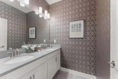 a bathroom with two sinks and a large mirror at Disney Getaway Private Pool Themed Bedrooms. Book Now SLR499 in Kissimmee