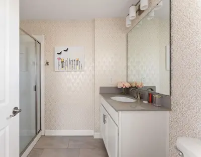 a bathroom with a sink and a large mirror at Disney Getaway Private Pool Themed Bedrooms. Book Now SLR499 in Kissimmee