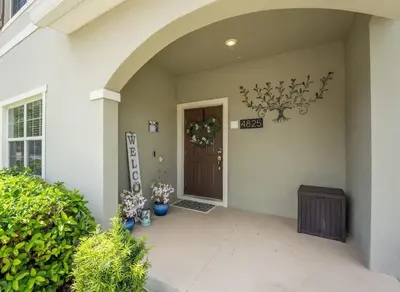 a front door of a house with areath on it at Disney Getaway Private Pool Themed Bedrooms. Book Now SLR499 in Kissimmee
